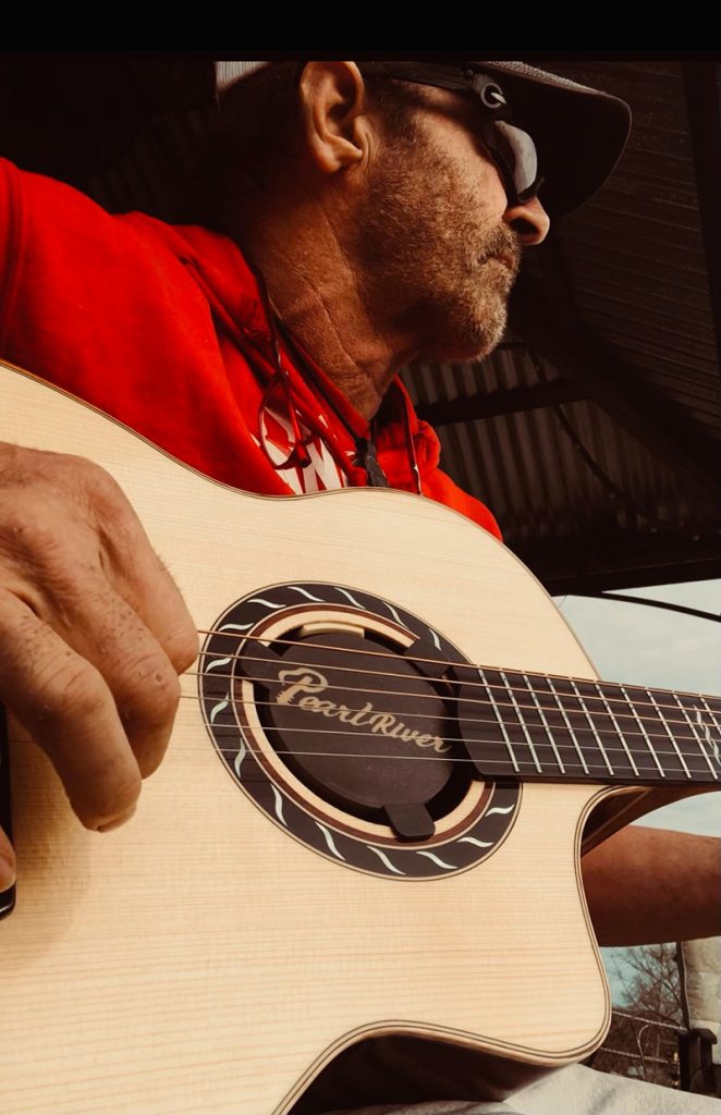 Keith with his Pearl River Guitar